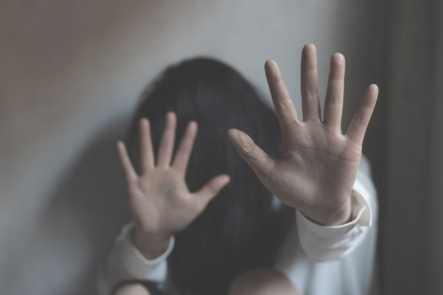 a woman protecting herself against violence