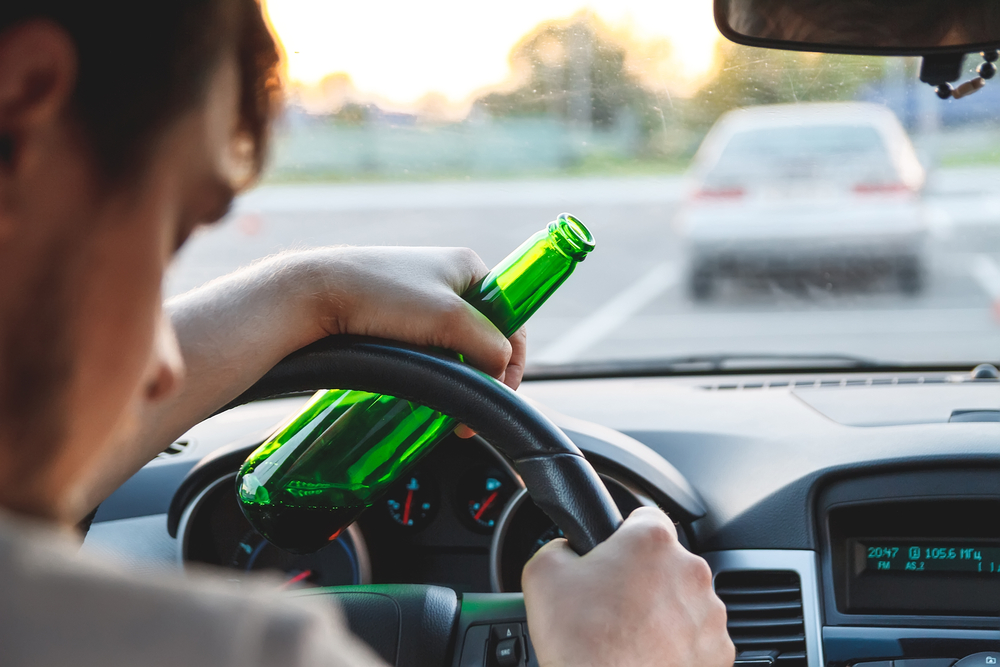 young man drunk behind the wheel