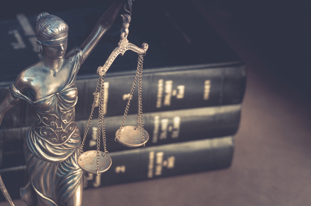 Statue of the scales of justice. If you are being accused of murder or assault, our Flower Mound murder and assault lawyers will fight to ensure fairness throughout your legal trial.