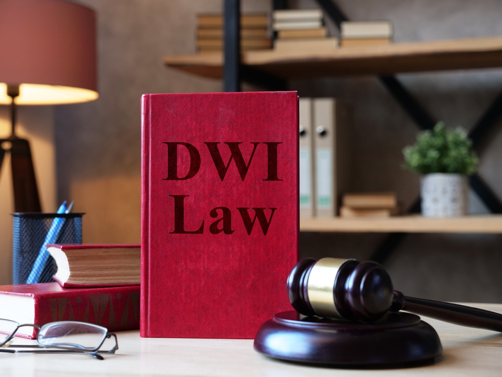 A DWI book and gavel. Find out how to build your defense with a felony DWI lawyer from The Colony.