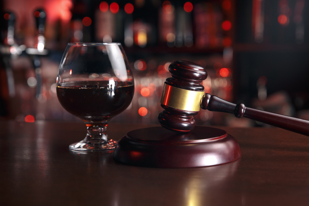 A gavel and glass of wine. You can build a legal defense with a Farmers Branch felony DWI lawyer.